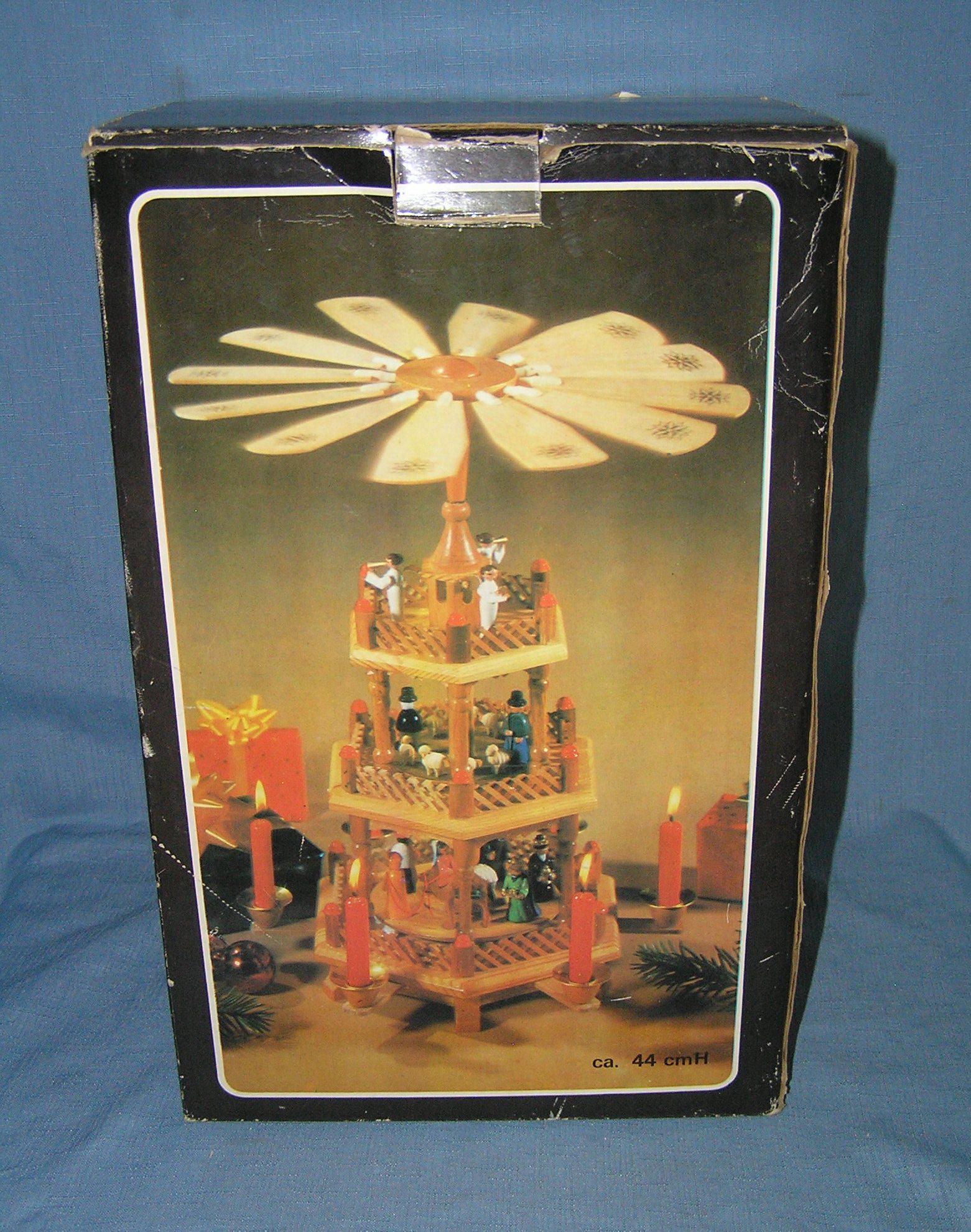 3 tiered holiday candle lit revolving center piece: 3 tiered holiday candle lit revolving center piece in original box, like new est. value $50.00-$60.00