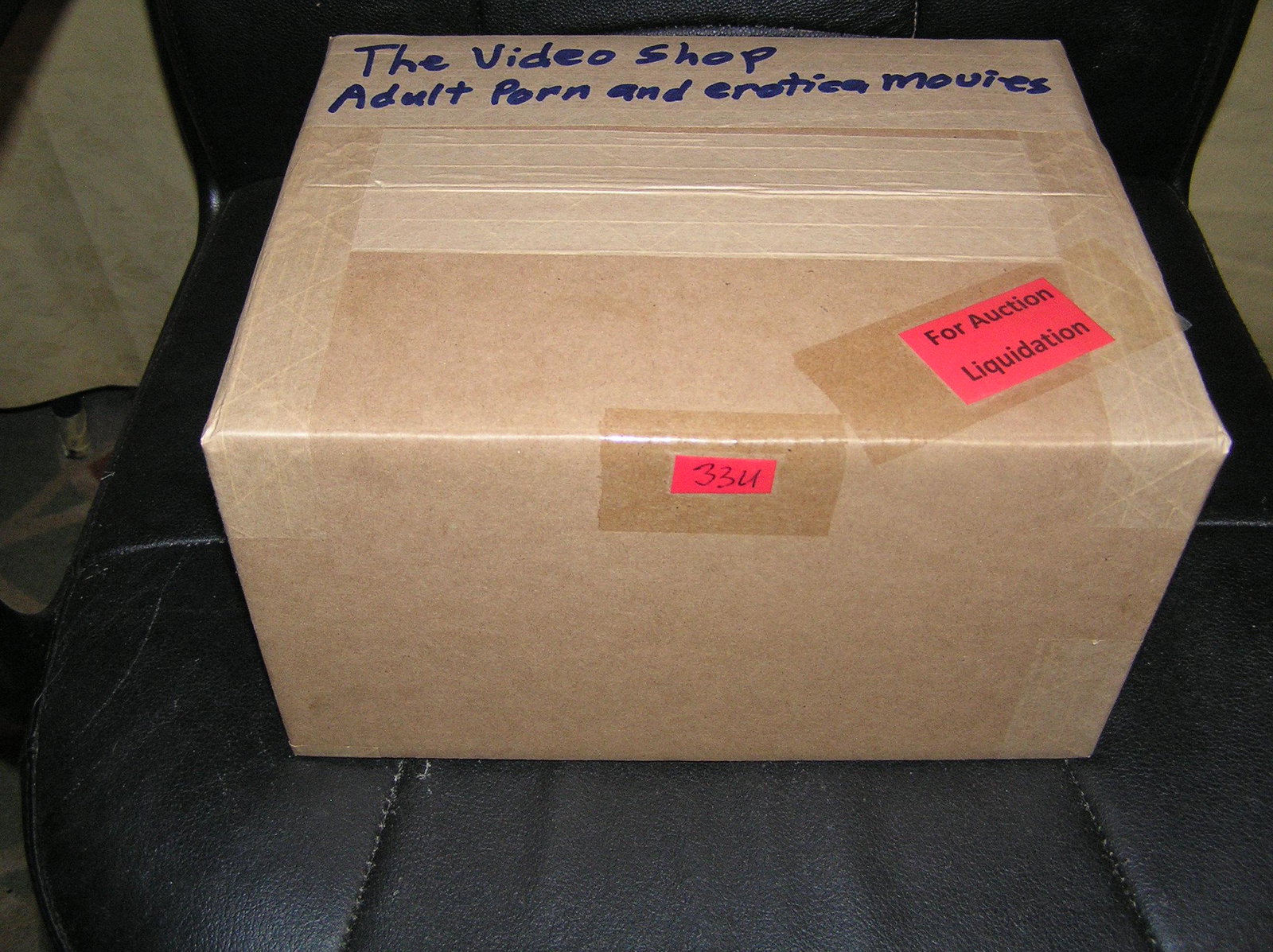 Moving and Storage Company mystery box lot marked The Video Shop: Moving and Storage Company mystery box lot marked The Video Shop: Adult Porn and Erotica movies part of a moving and storage company seized or unclaimed merchandise group sent to auction for liquidati