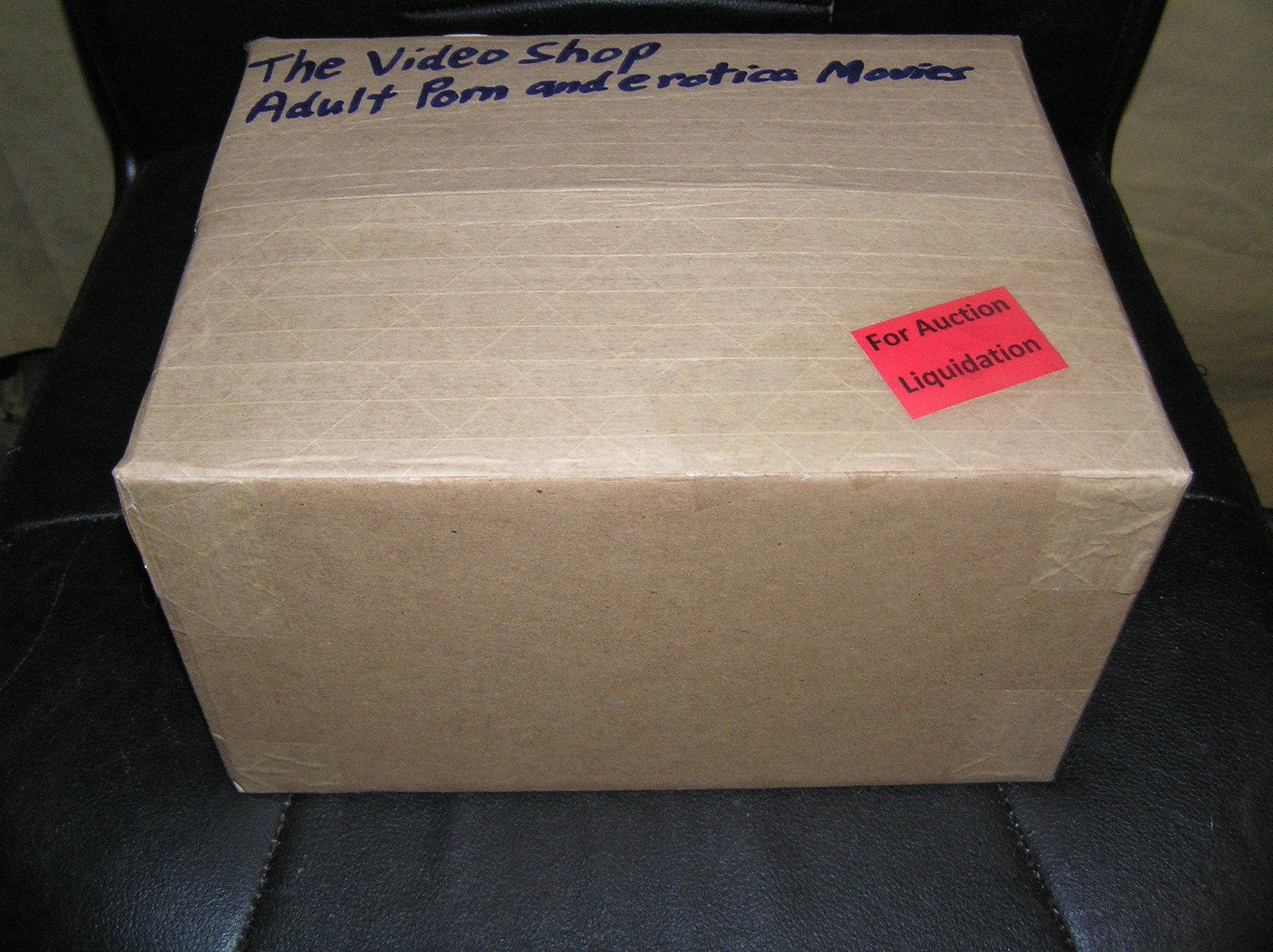 Moving and Storage Company mystery box lot marked The Video Shop: Moving and Storage Company mystery box lot marked The Video Shop: Adult Porn and Erotica movies part of a moving and storage company seized or unclaimed merchandise group sent to auction for liquidati