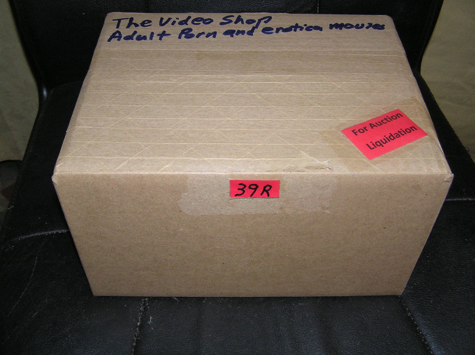 Moving and Storage Company mystery box lot marked The Video Shop: Moving and Storage Company mystery box lot marked The Video Shop: Adult Porn and Erotica Movies part of a moving and storage company seized or unclaimed merchandise group sent to auction for liquidati