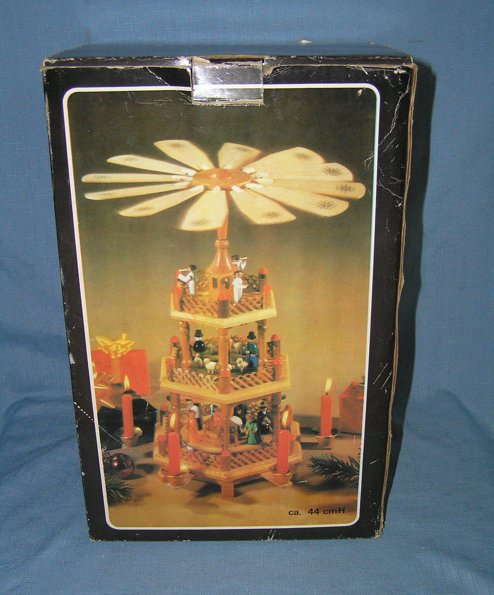 3 tiered holiday candle lit revolving center piece: 3 tiered holiday candle lit revolving center piece in original box, like new est. value $50.00-$60.00