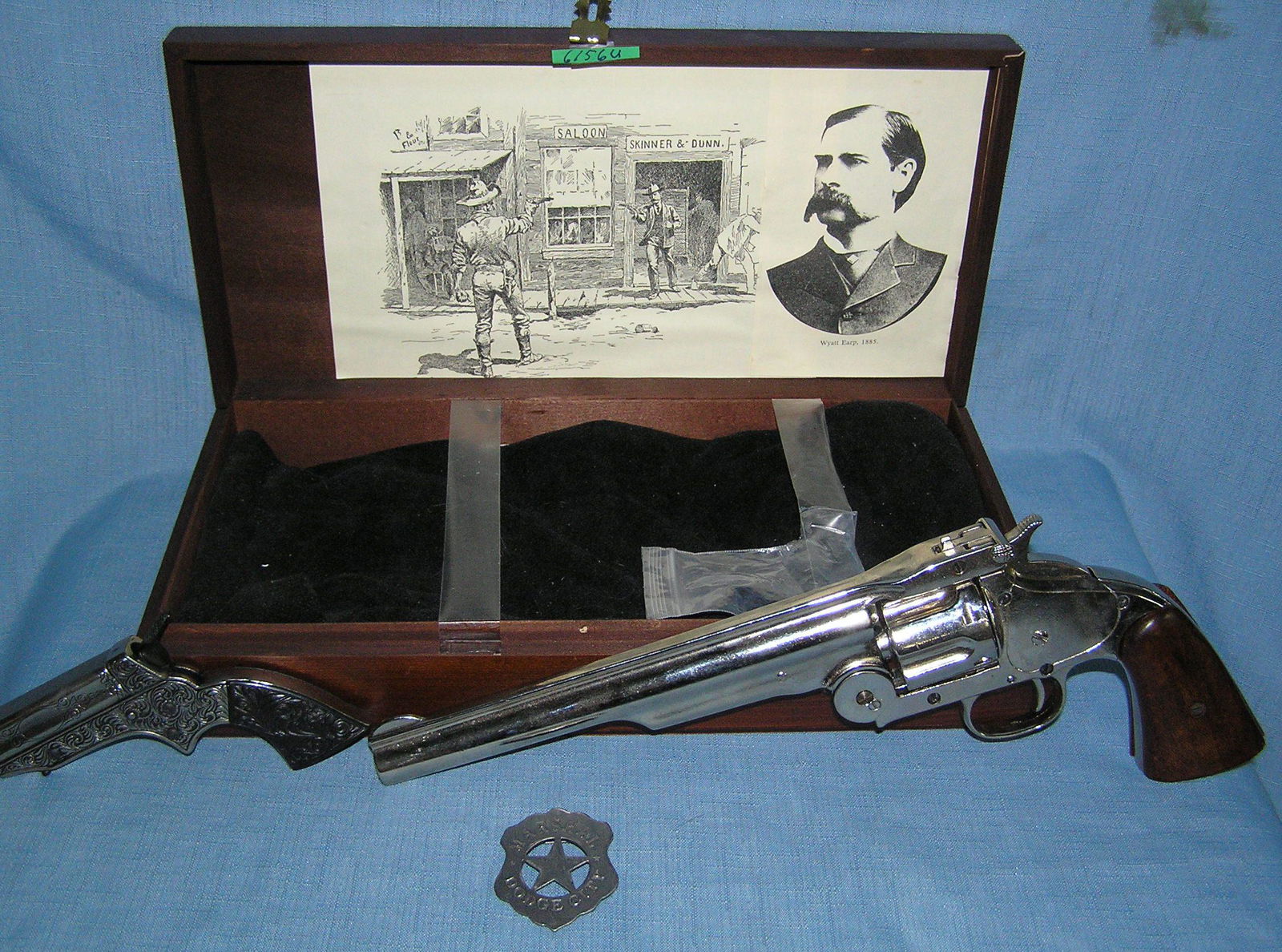 Wyatt Earp revolver Derringer and Dodge City badge set: Super high quality Wyatt Earp revolver Derringer and marshall of Dodge City badge set in original walnut display case replica model all metal and wood gun set and badge in a walnut case est. value $30