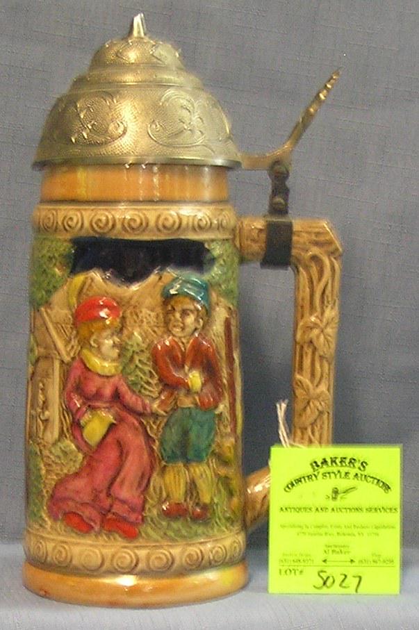 Vintage porcelain beer stein with modern plastic lid: Vintage porcelain beer stein with modern plastic lid $40.00-$50.00
