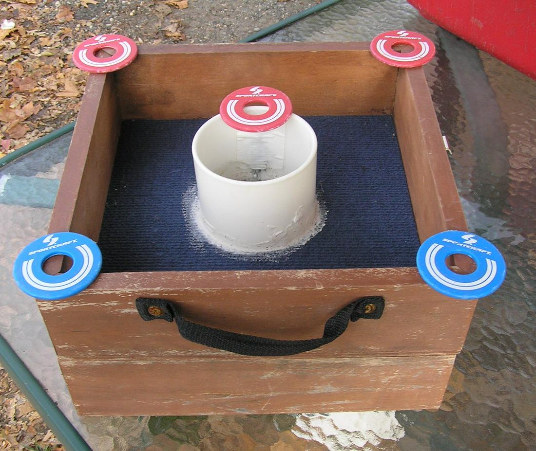 Bulls eye washers ring toss game: Bulls eye washers ring toss game in wood display box by Fundex est. value $40.00-$50.00