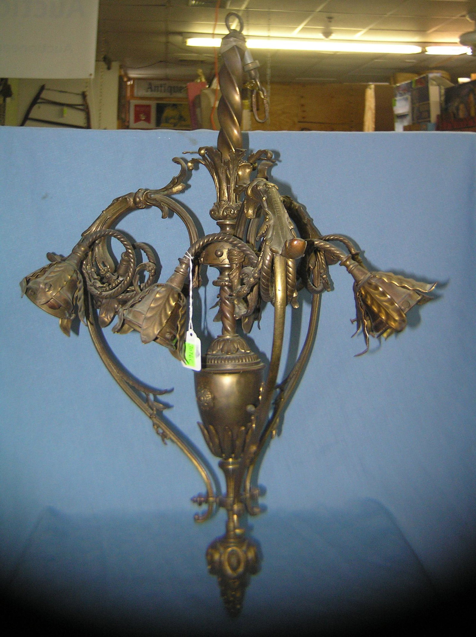 Solid brass chandelier with leaf decorations: Solid brass chandelier with leaf decorations est. value $400.00-$500.00