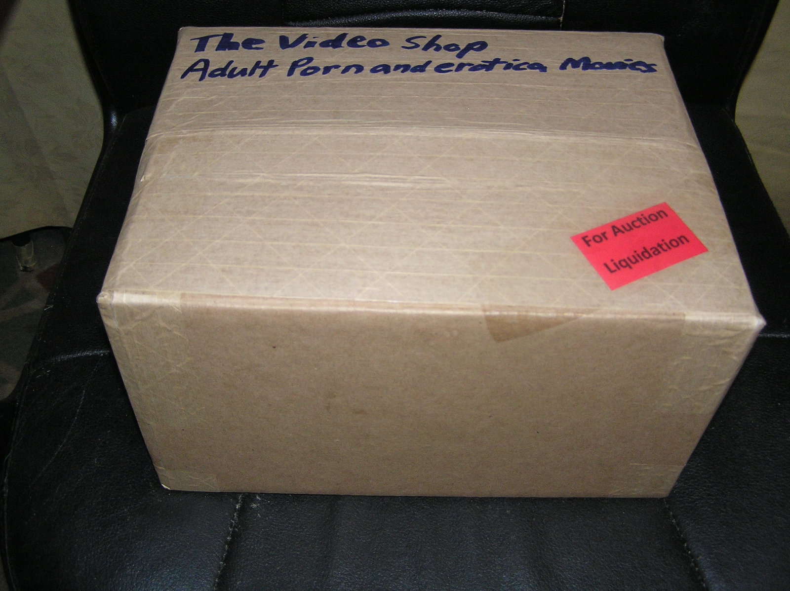 Moving and Storage Company mystery box lot marked The Video Shop: Moving and Storage Company mystery box lot marked The Video Shop: Adult Porn and Erotica movies part of a moving and storage company seized or unclaimed merchandise group sent to auction for liquidati