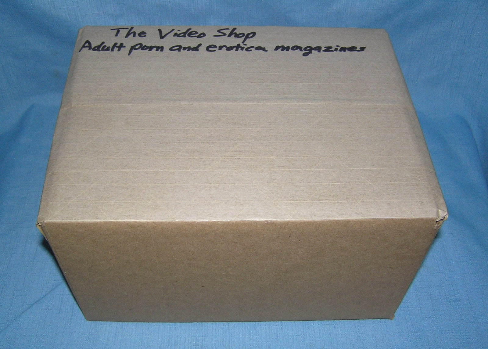 Moving and Storage Company mystery box lot marked The Video Shop: Moving and Storage Company mystery box lot marked The Video Shop: Adult Porn and Erotica Magazines part of a moving and storage company seized or unclaimed merchandise group sent to auction for liquid