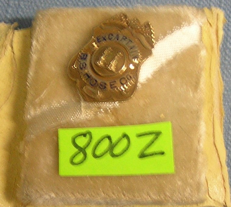 Early gold mini fire captain presentation shield: Early gold mini fire captain presentation shield dated 1952 $100.00-$150.00