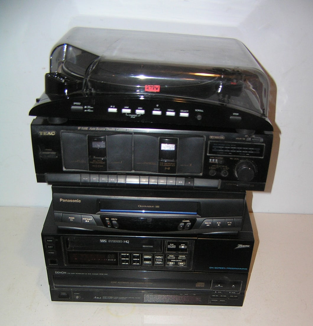 Group of modern electronics: Group of modern electronics includes Ion I Profile turn table, Teac auto reverse double cassette deck, Denon automatic disc loading system, Zenith onscreen programing VHS stereo an dPan asonic omnivis