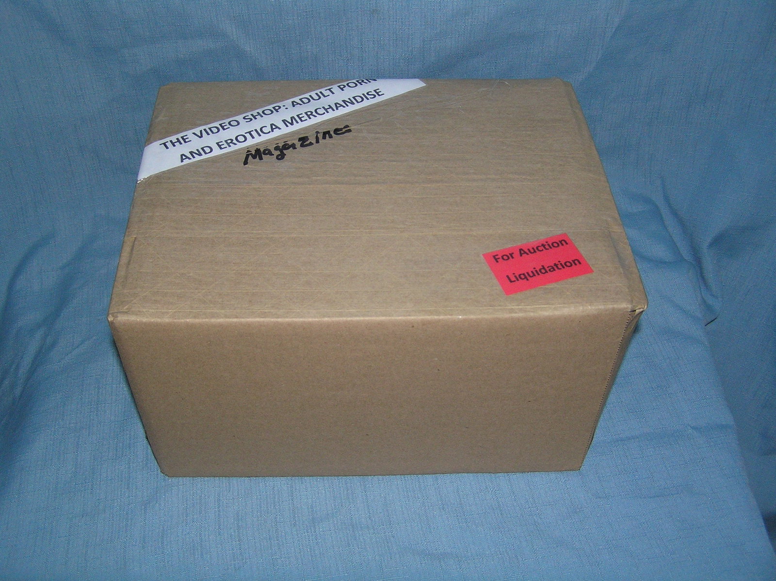Moving and Storage Company mystery box lot marked The Video Shop: Moving and Storage Company mystery box lot marked The Video Shop: Adult Porn and Erotica Magazines part of a moving and storage company seized or unclaimed merchandise group sent to auction for liquid