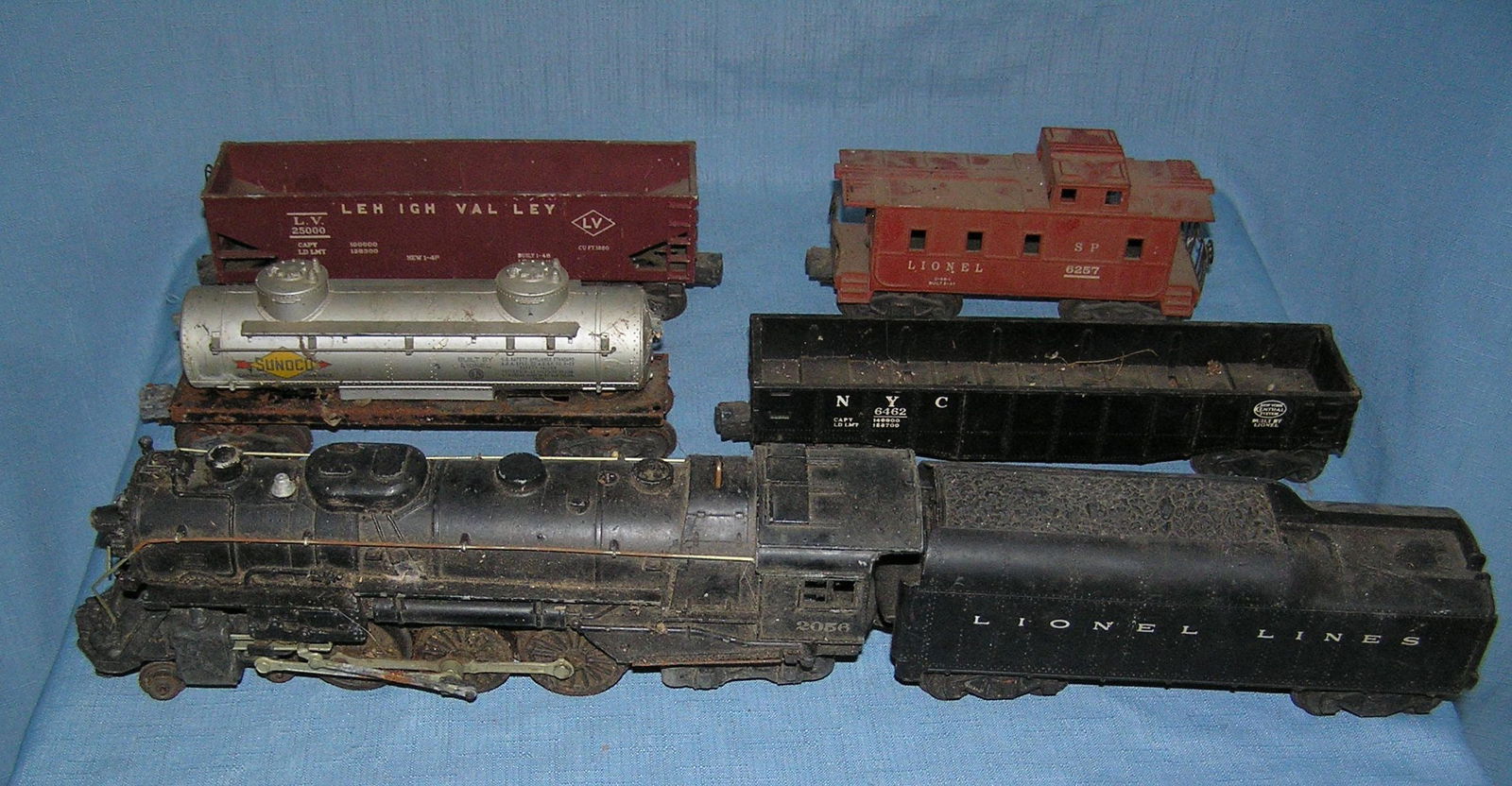 Box full of old Lionel trains: Box full of old Lionel trains includes an old metal locomotive, coal tender, collection of frieght cars and caboose, transformer, RR tracks and accessories est. value $500.00-$600.00