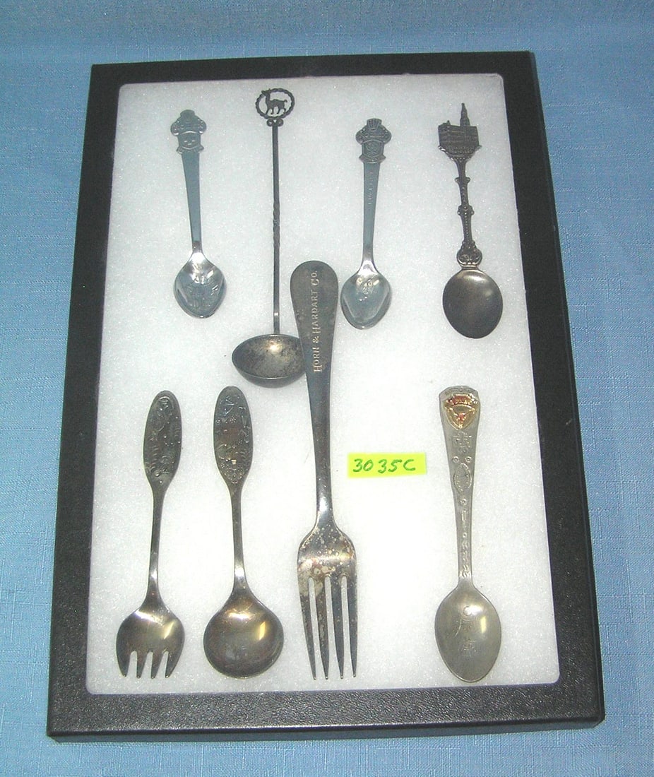 Collection of souvenir spoons and fork: Collection of souvenir spoons and fork includes Rolex, Hotel de Ville, Horn and Hardart Co., Texas and more est. value $65.00-$75.00