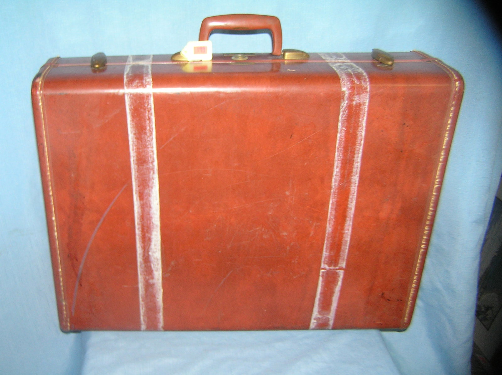 Vintage leather luggage case by Samsonite: Vintage leather luggage case by Samsonite of Denver CO large size, condition as found: 2 tape marks around case that can be removed est. value $40.00-$50.00