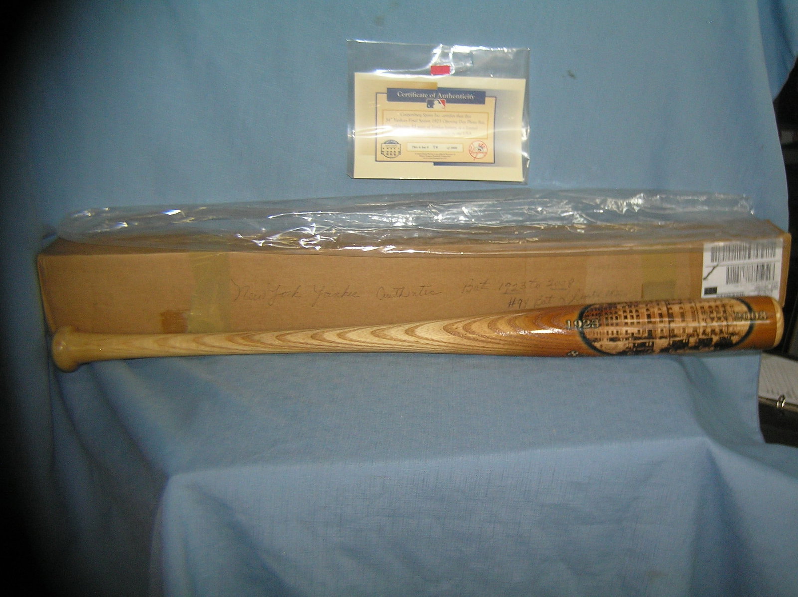 NY Yankees 1923 photo illustrated baseball bat: Limited edition NY Yankees 34 inch final season of 1923 photo illustrated baseball bat commemorating 85 years of tradition mint in box with COA est. value $175.00--$200.00