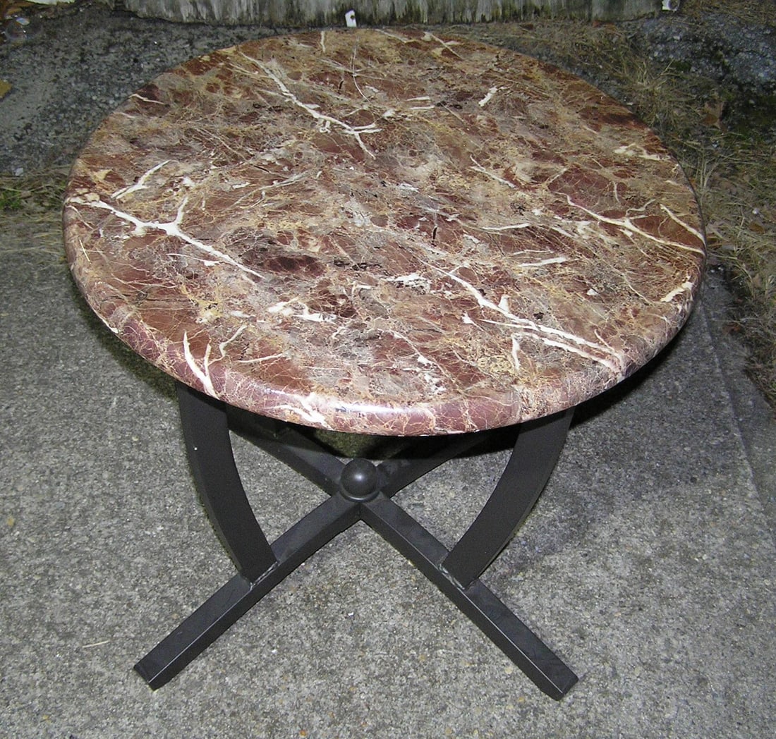 Marbelized end table 23 inches round: Marbelized end table 23 inches round all metal base by King Tree Hand Craft Inc. of California customer to arrange pickup or delivery of this item est. value $150.00-$200.00