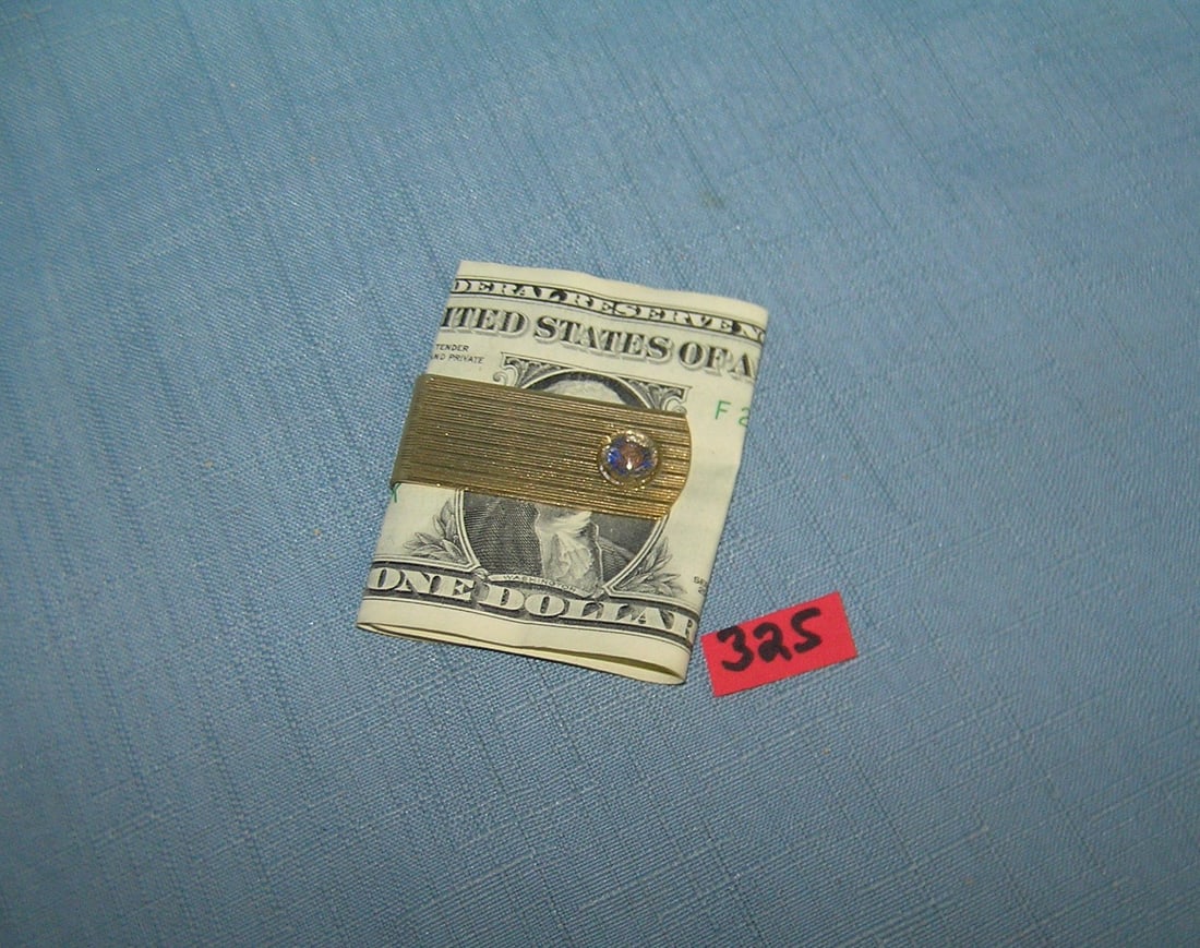 Vintage gold plated money clip: Vintage gold plated money clip est. value $25.00-$30.00