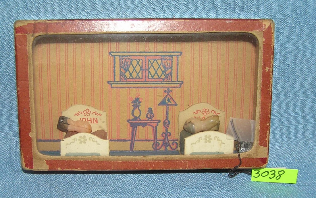 John and Mary husband and wife dexterity toy: John and Mary husband and wife twin beds dexterity toy featuring a pair of beds in a bedroom setting with celluloid figures est. value $65.00-$75.00