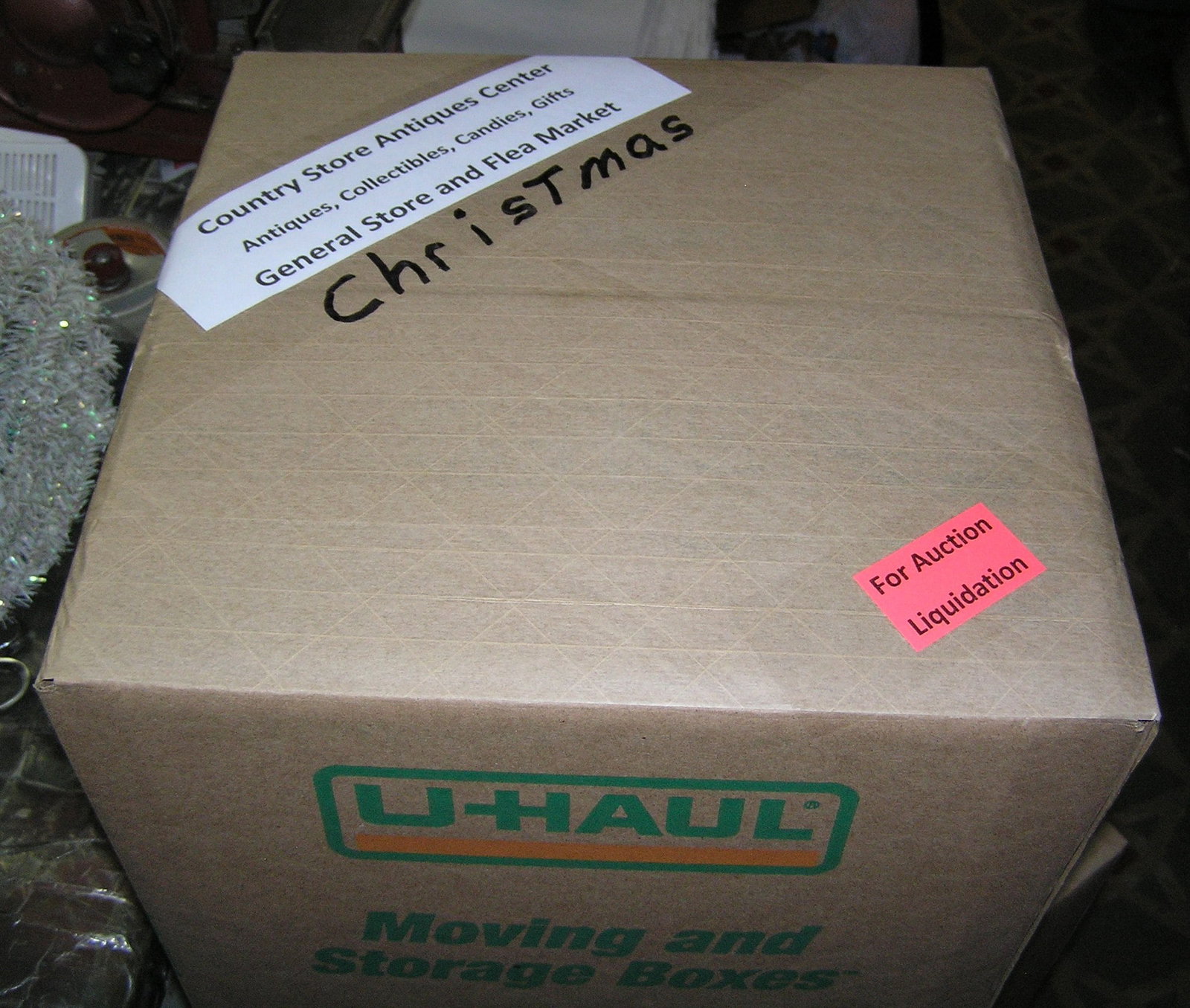 Moving and Storage Company mystery box lot: Moving and Storage Company mystery box lot marked Christmas, Country Store Antiques Center: Antiques, Collectibles, Candies, Gifts, General Store and Flea Market part of a moving and storage company s