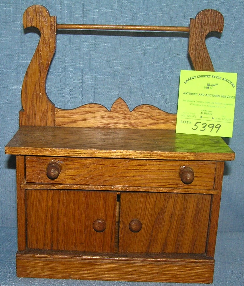Antique oak miniature wash stand salesman sample: Antique oak miniature wash stand salesman sample est. value $175.00-$200.00