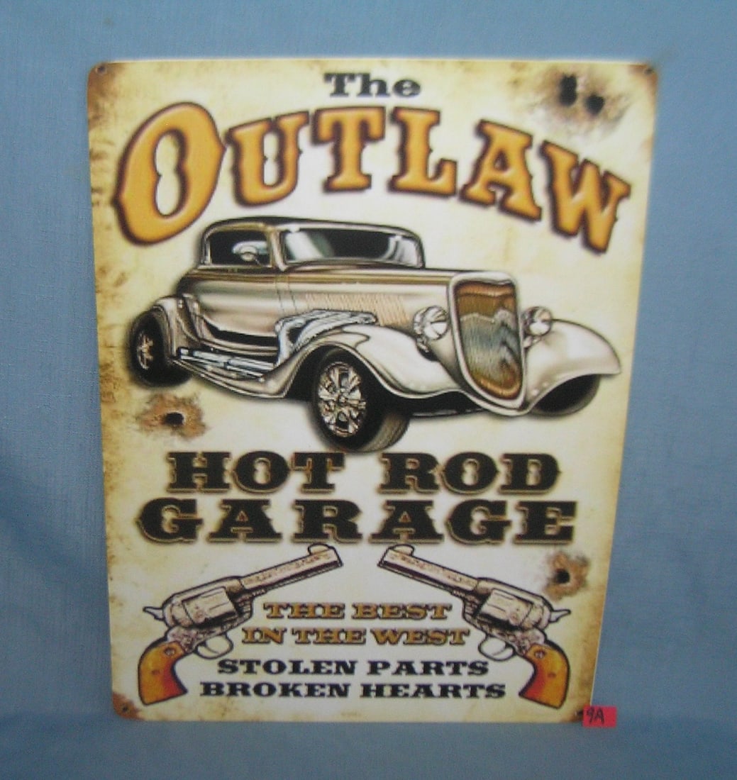 The Outlaw Hot Rod Garage retro style sign: The Outlaw Hot Rod Garage 12 by 16 inches retro style advertising sign printed on PVC hard board these signs are auctioned for there decorative and display purposes est. value $45.00-$60.00