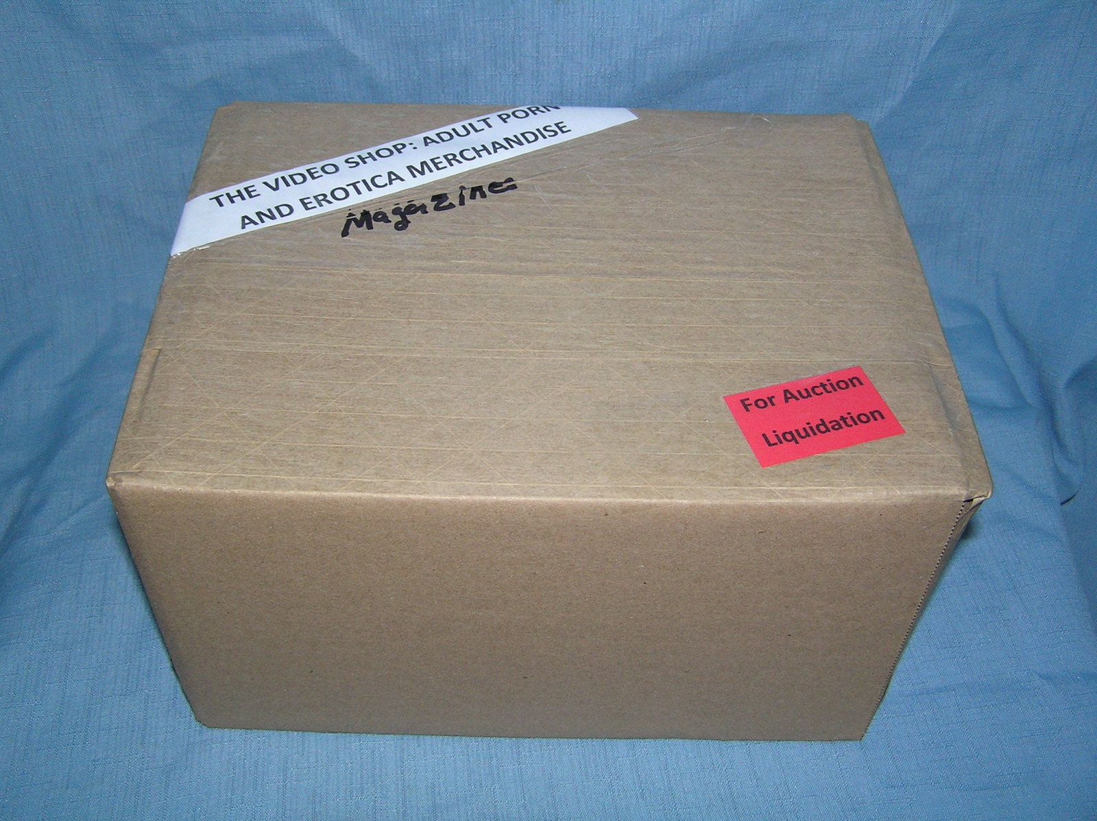 Moving and Storage Company mystery box lot marked The Video Shop: Moving and Storage Company mystery box lot marked The Video Shop: Adult Porn and Erotica Magazines part of a moving and storage company seized or unclaimed merchandise group sent to auction for liquid