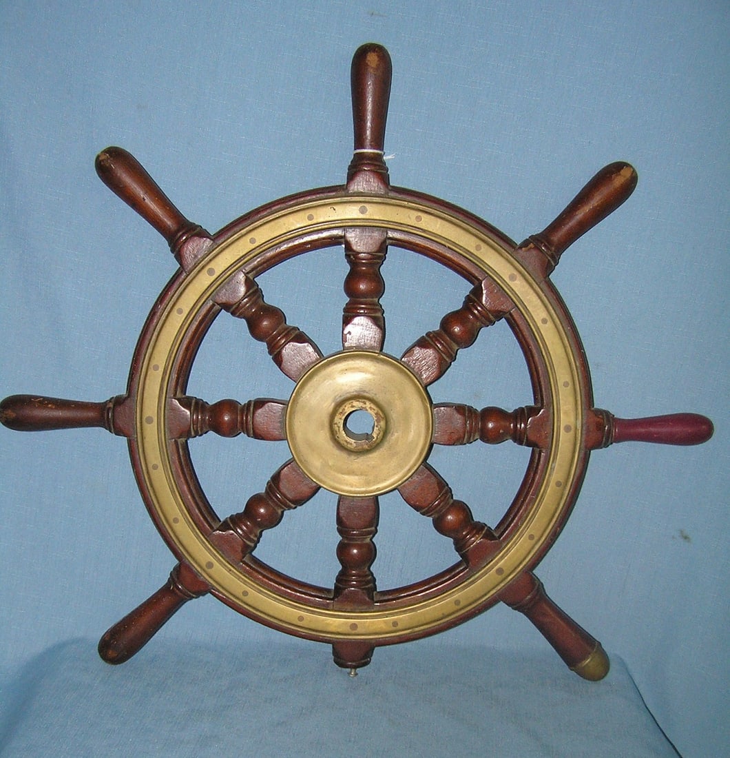 Antique brass and walnut ship's wheel: Antique brass and walnut ship's wheel condition as found one handle is missing and one has been replaced est. value $225.00-$250.00