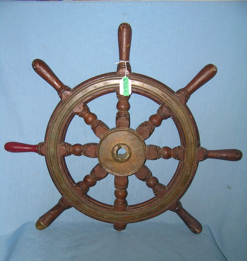 Antique brass and walnut ship's wheel: Antique brass and walnut ship's wheel condition as found one handle is missing and one has been replaced est. value $225.00-$250.00