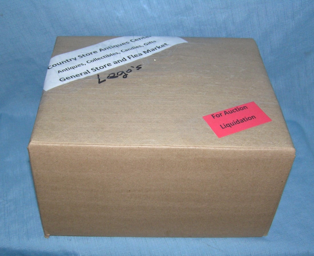 Moving and Storage Company mystery box lot: Moving and Storage Company mystery box lot marked The Country Store Antiques Center: Antiques, Collectibles, Candies, Gifts General Store and Flea Market, contents Lego's part of a moving and storage 