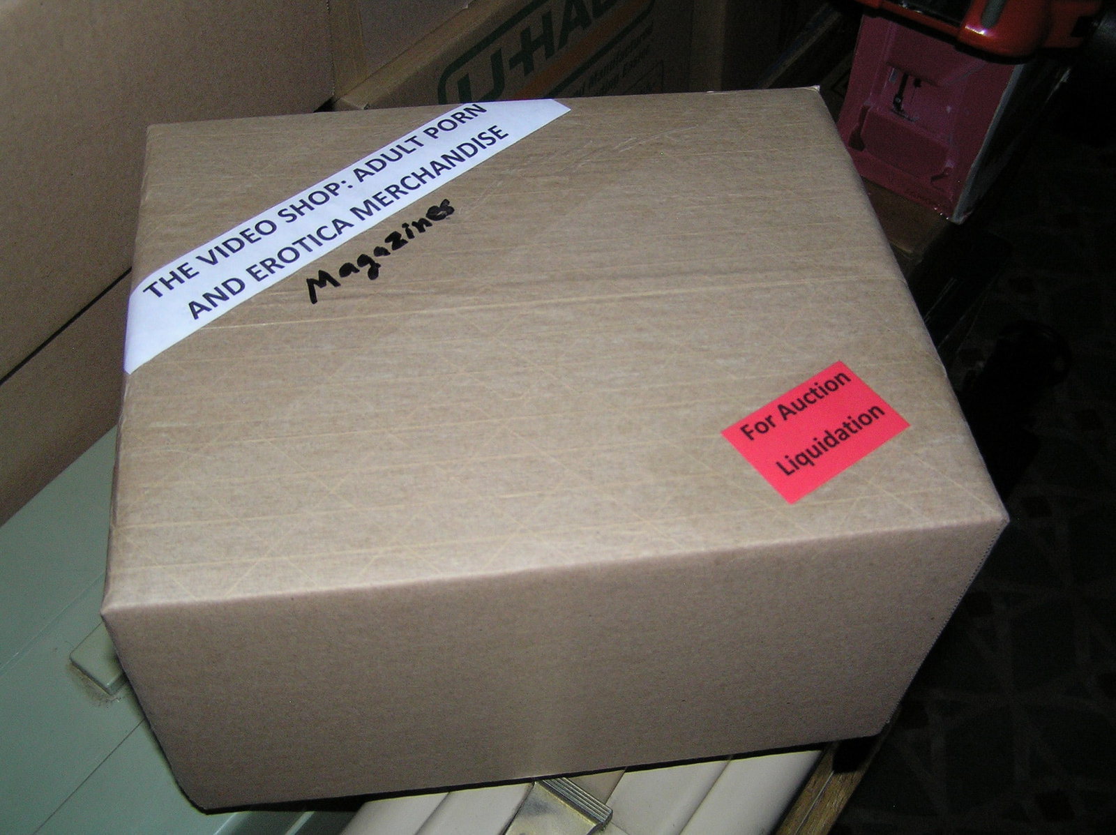 Moving and Storage Company mystery box lot marked The Video Shop: Moving and Storage Company mystery box lot marked The Video Shop: Adult Porn and Erotica Magazines part of a moving and storage company seized or unclaimed merchandise group sent to auction for liquid