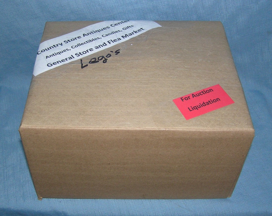 Moving and Storage Company mystery box lot: Moving and Storage Company mystery box lot marked The Country Store Antiques Center: Antiques, Collectibles, Candies, Gifts General Store and Flea Market, contents Lego's part of a moving and storage 