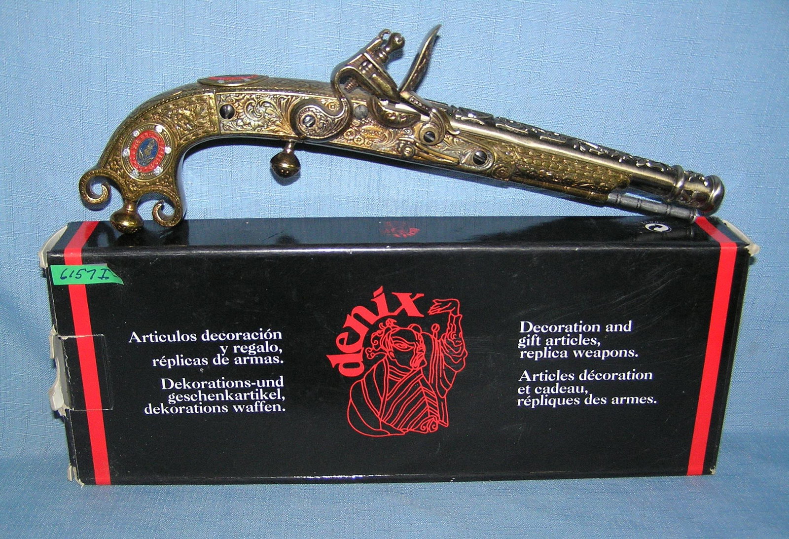 Super High quality engraved brass replicaflint lock pistol: Super High quality engraved brass flint lock pistol replica model collectors gun all metal and wood with original box est. value $300.00-$350.00