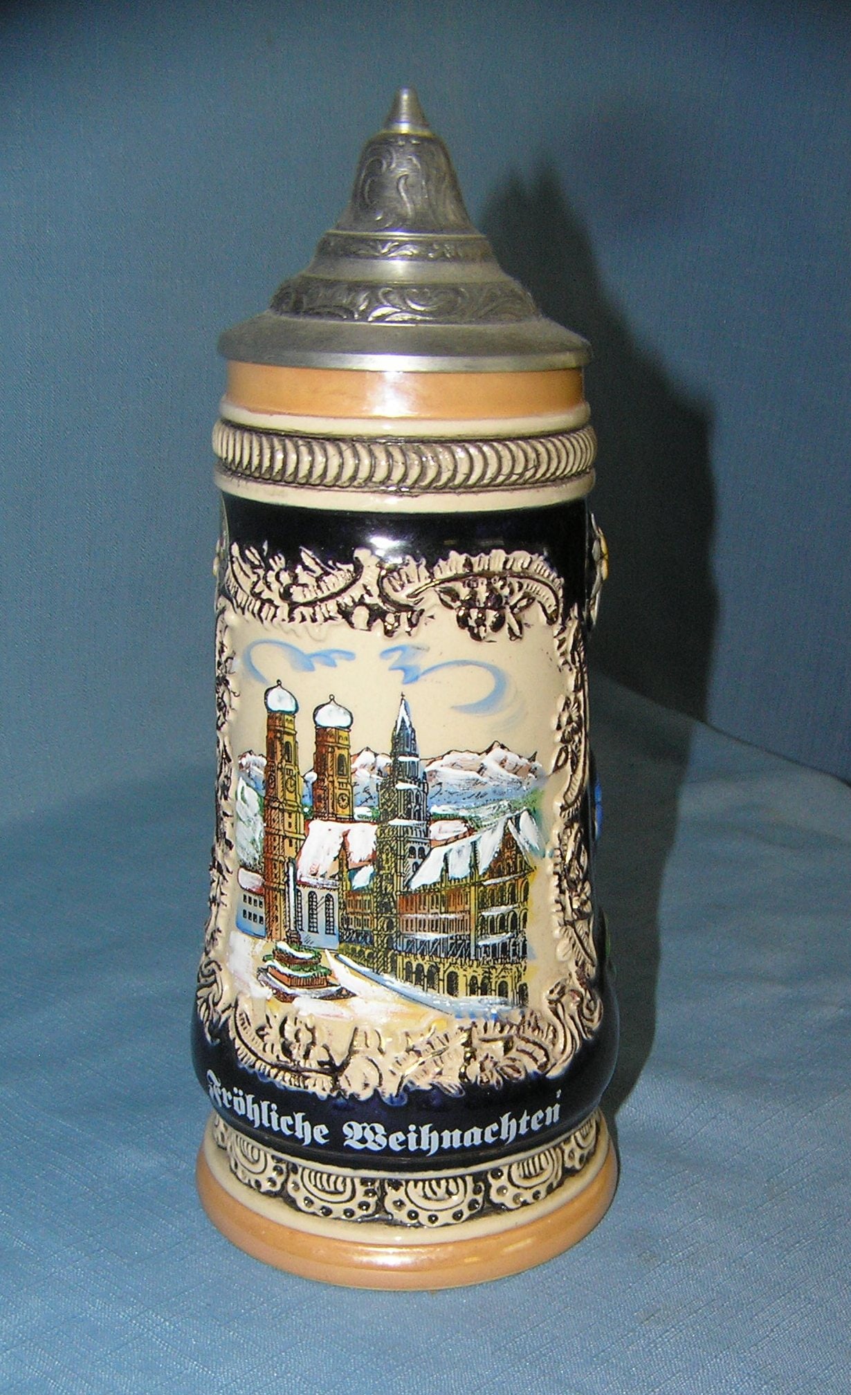 Vintage German beer stein: Vintage German beer stein features early German city buildings est. value $125.00-$150.00