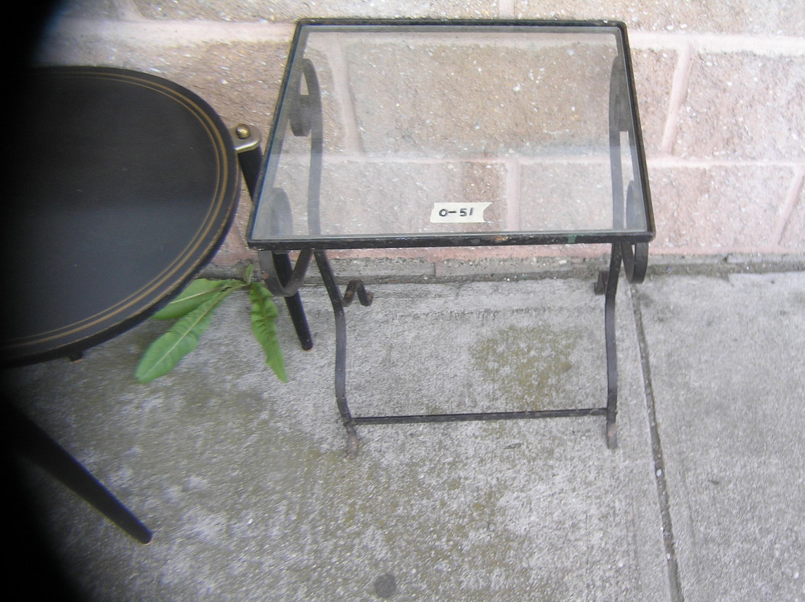 Wrought iron and glass side table: Wrought iron and glass side table est. value $25.00-30.00