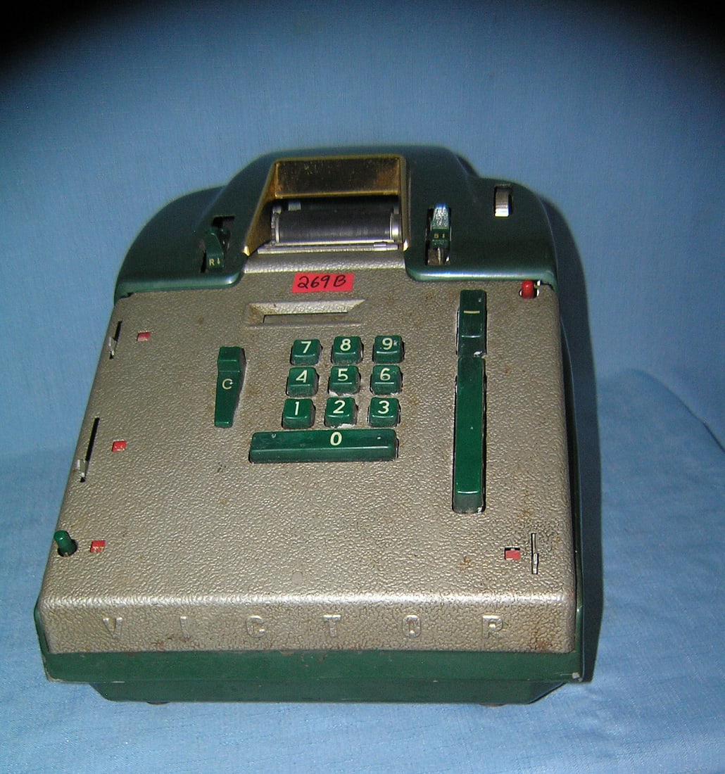 Great early Victor adding machine: Great early Victor adding machine brass, metal and Bakelite constuction made by the Victor Adding Machine Co. Chicago IL est. value $200.00-$225.00