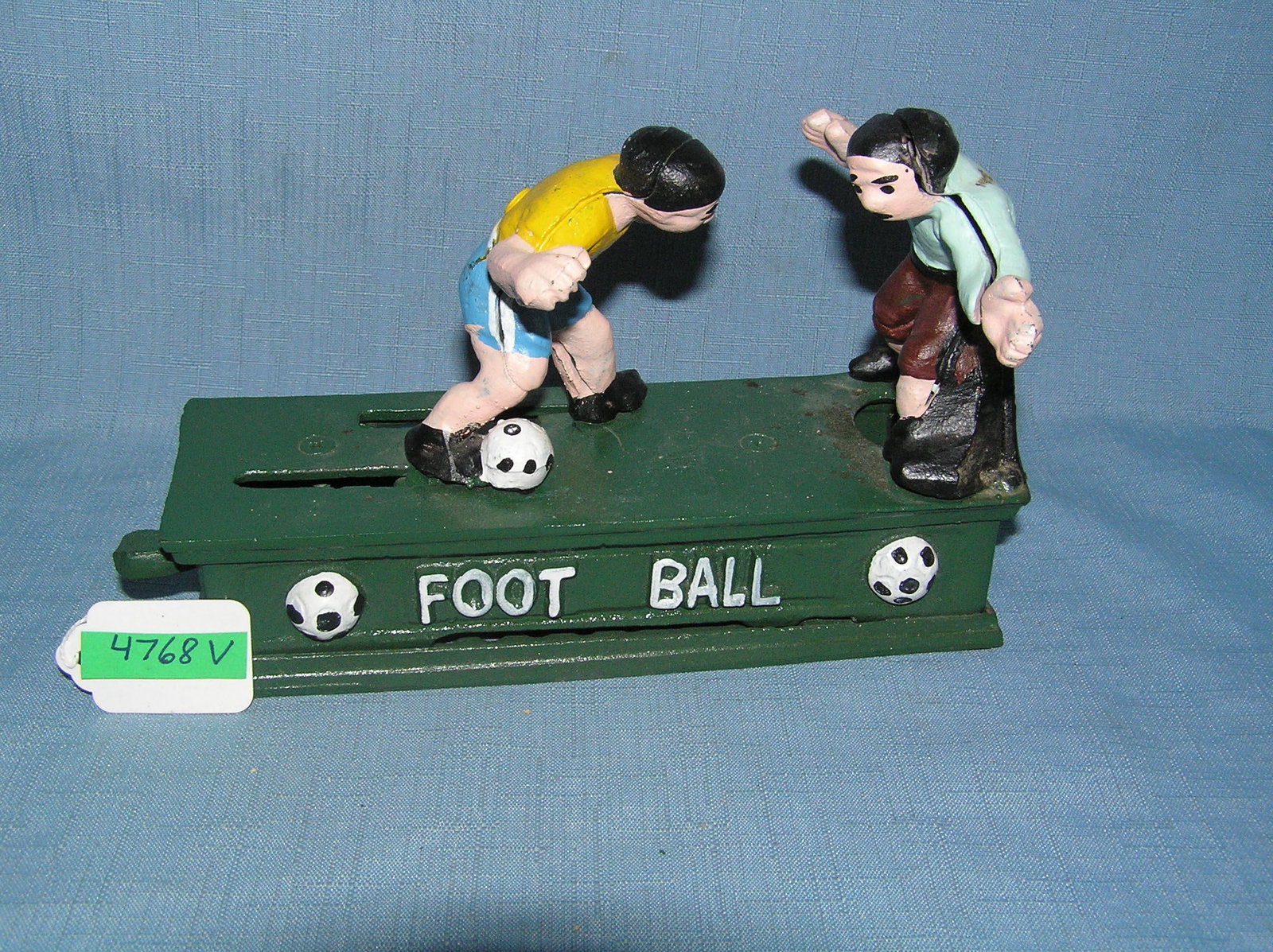 Football soccer cast iron mechanical bank: Football soccer cast iron mechanical bank est. value $200.00-$250.00