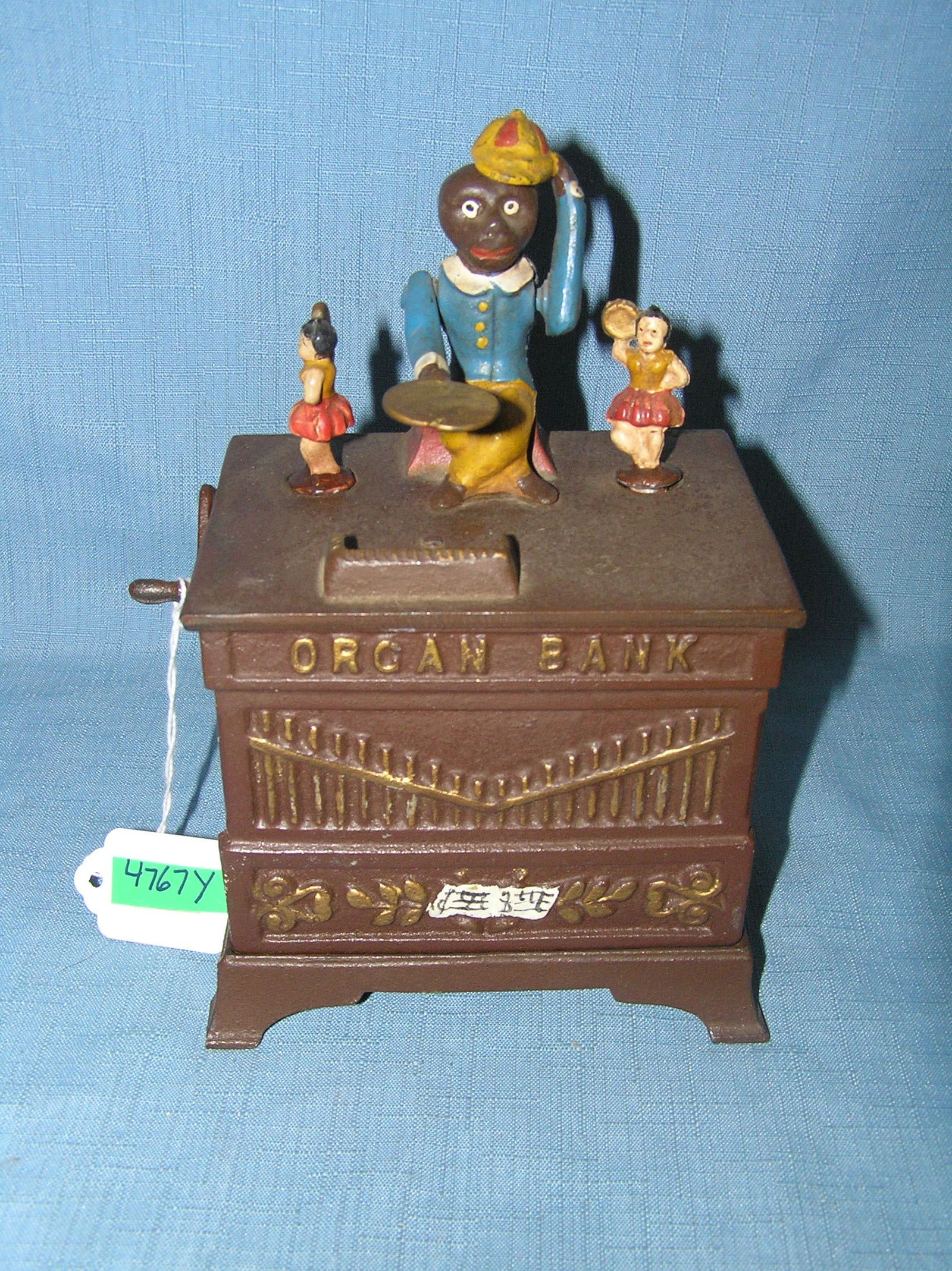 Organ Bank cast iron mechanical bank circa 1950s: Organ Bank cast iron mechanical bank circa 1950s from the Book of Knowledge series est. value $500.00-$550.00