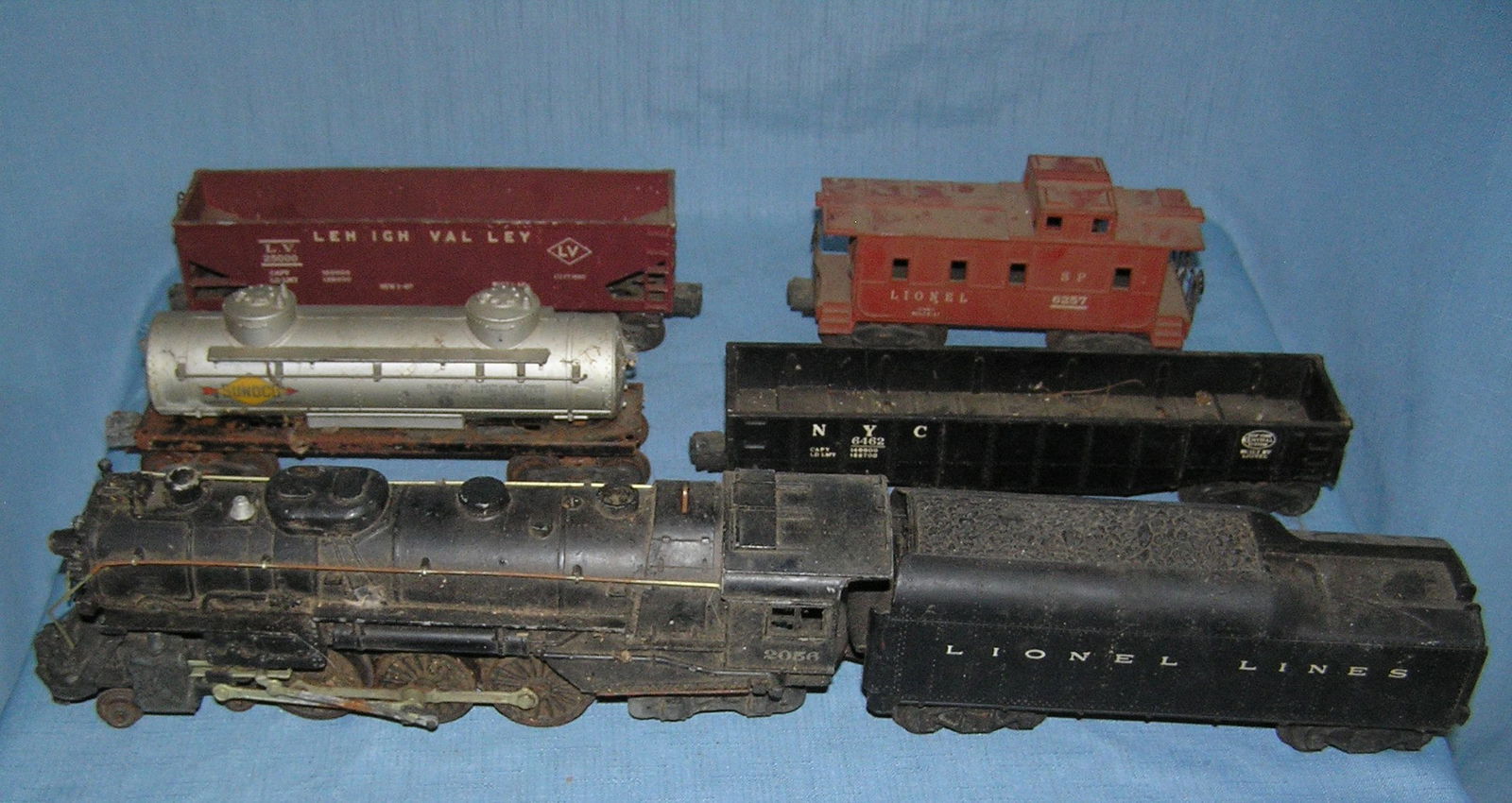Box full of old Lionel trains: Box full of old Lionel trains includes an old metal locomotive, coal tender, collection of frieght cars and caboose, transformer, RR tracks and accessories est. value $500.00-$600.00