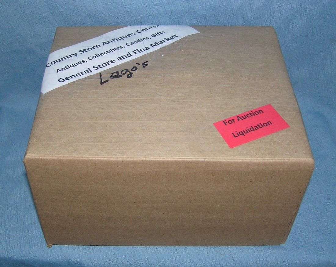 Moving and Storage Company mystery box lot: Moving and Storage Company mystery box lot marked The Country Store Antiques Center: Antiques, Collectibles, Candies, Gifts General Store and Flea Market, contents Lego's part of a moving and storage 