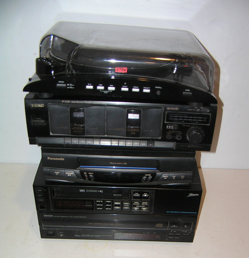 Group of modern electronics: Group of modern electronics includes Ion I Profile turn table, Teac auto reverse double cassette deck, Denon automatic disc loading system, Zenith onscreen programing VHS stereo an dPan asonic omnivis