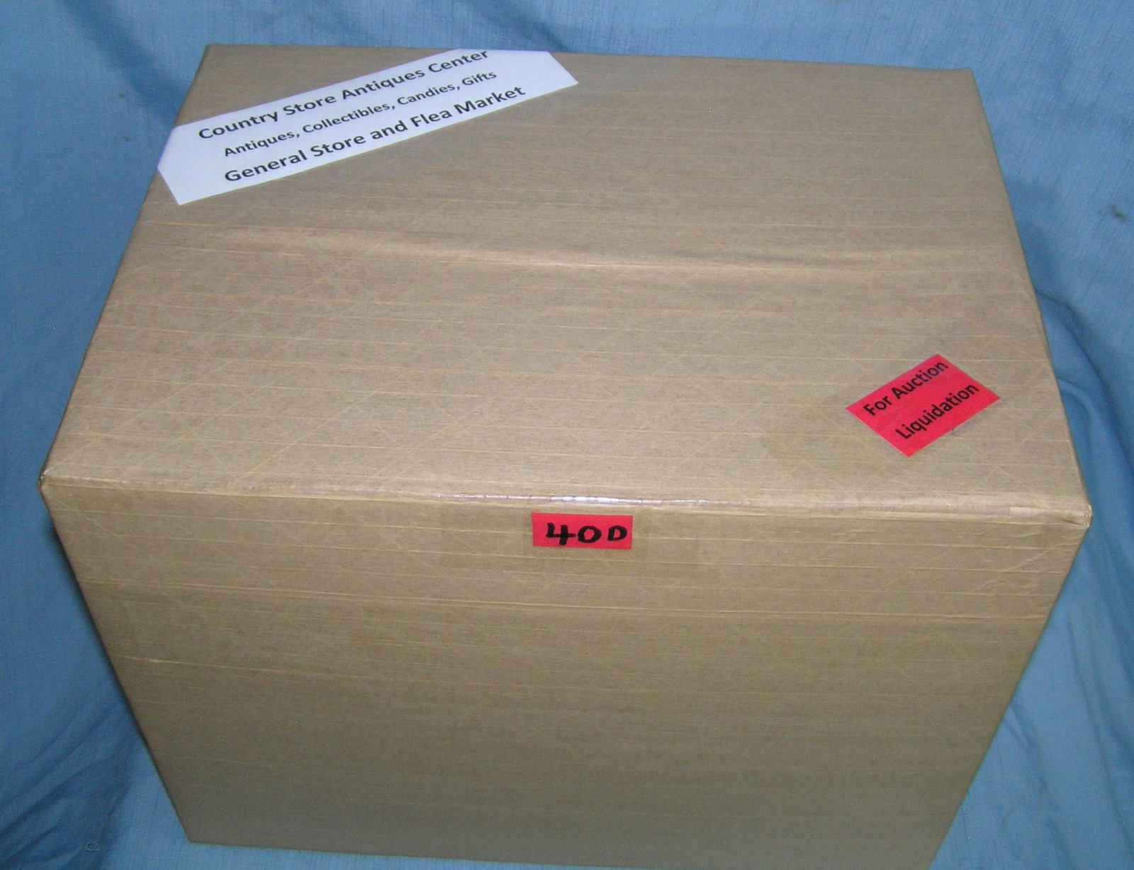 Moving and Storage Company mystery box lot: Moving and Storage Company mystery box lot marked Country Store Antiques Center: Antiques, Collectibles, Candies, Gifts, General Store and Flea Market part of a moving and storage company seized or un