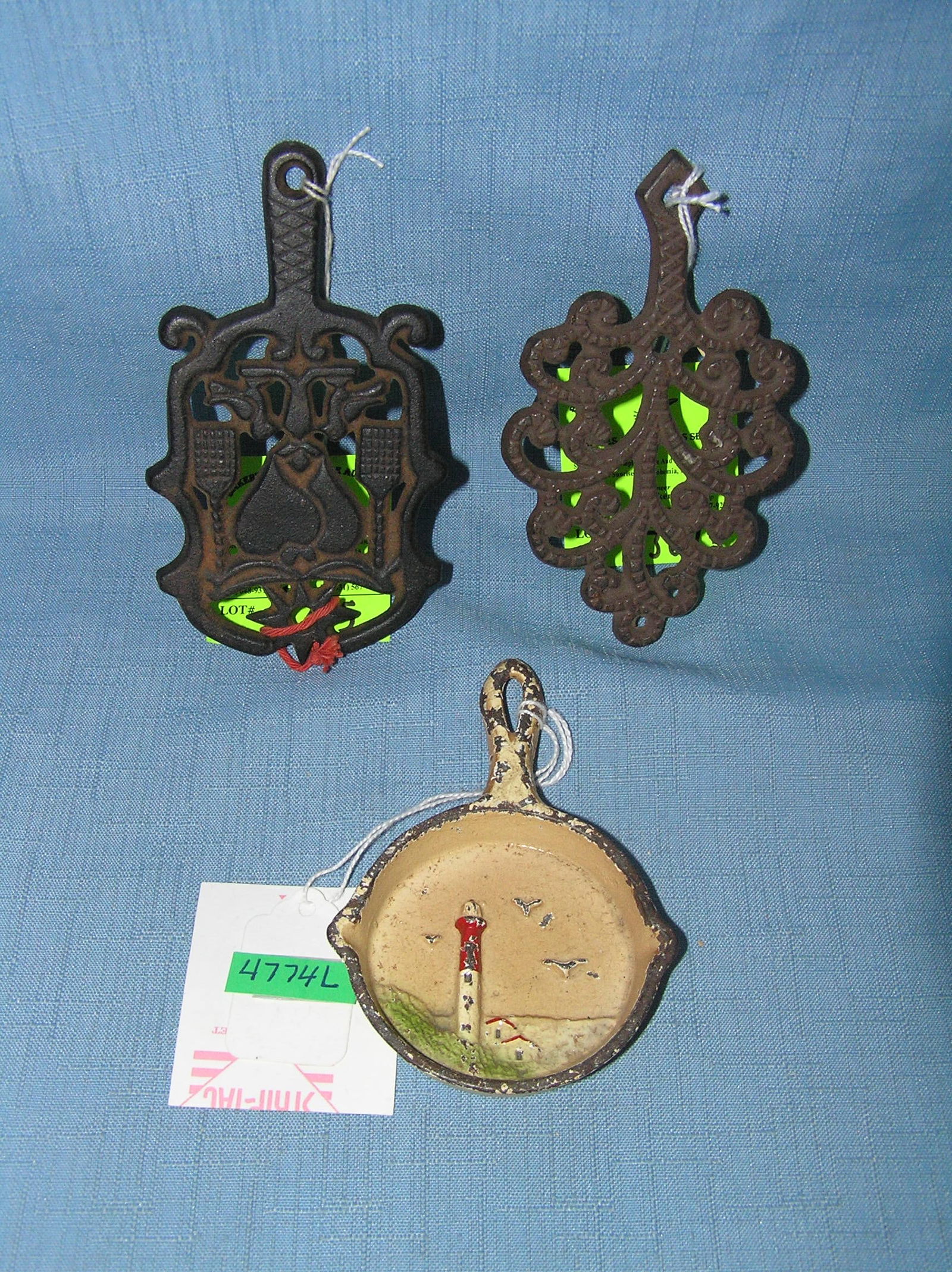 Group of miniture cast iron trivets and frying pan: Group of miniture cast iron trivets and frying pan est. value $100.00-$125.00