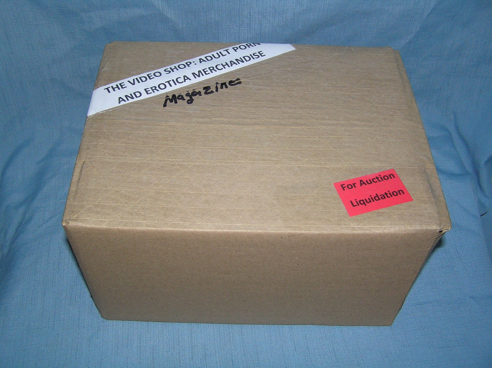 Moving and Storage Company mystery box lot marked The Video Shop: Moving and Storage Company mystery box lot marked The Video Shop: Adult Porn and Erotica Magazines part of a moving and storage company seized or unclaimed merchandise group sent to auction for liquid