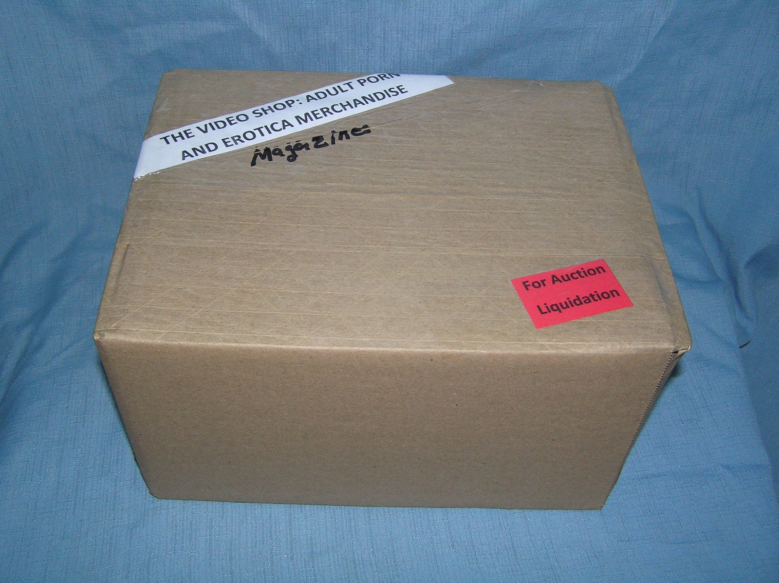 Moving and Storage Company mystery box lot marked The Video Shop: Moving and Storage Company mystery box lot marked The Video Shop: Adult Porn and Erotica Magazines part of a moving and storage company seized or unclaimed merchandise group sent to auction for liquid