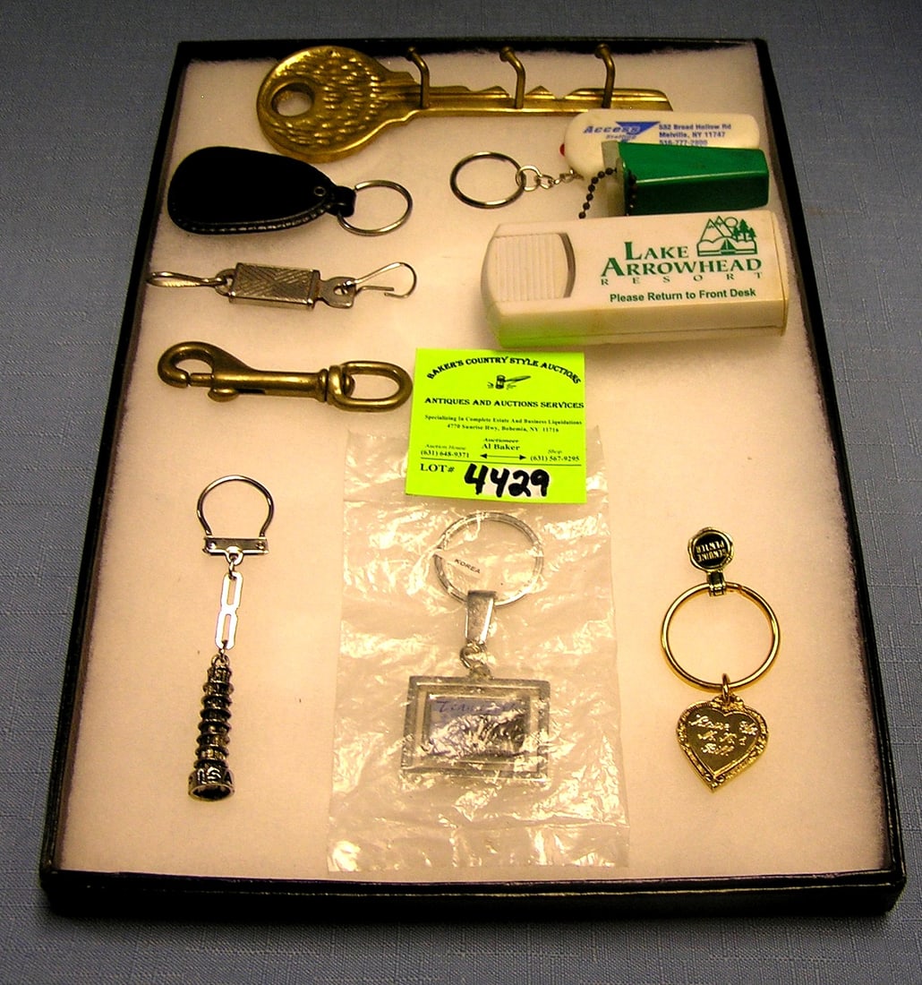 Collection of vintage key chains and holders: Collection of vintage key chains and holders est. value $40.00-$50.00