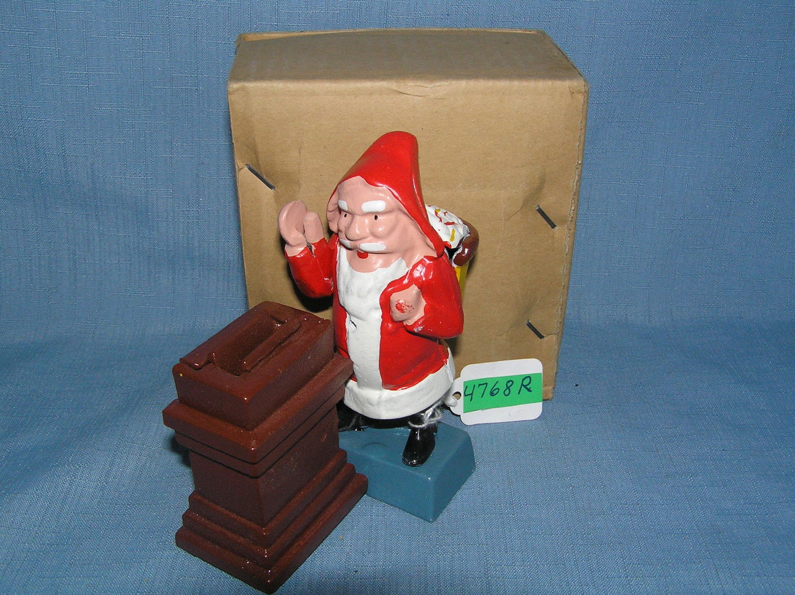 Santa Claus at chimney cast iron mechanical bank circa 1960s: Santa Claus at chimney cast iron mechanical bank circa 1960s with original box est. value $200.00-$250.00
