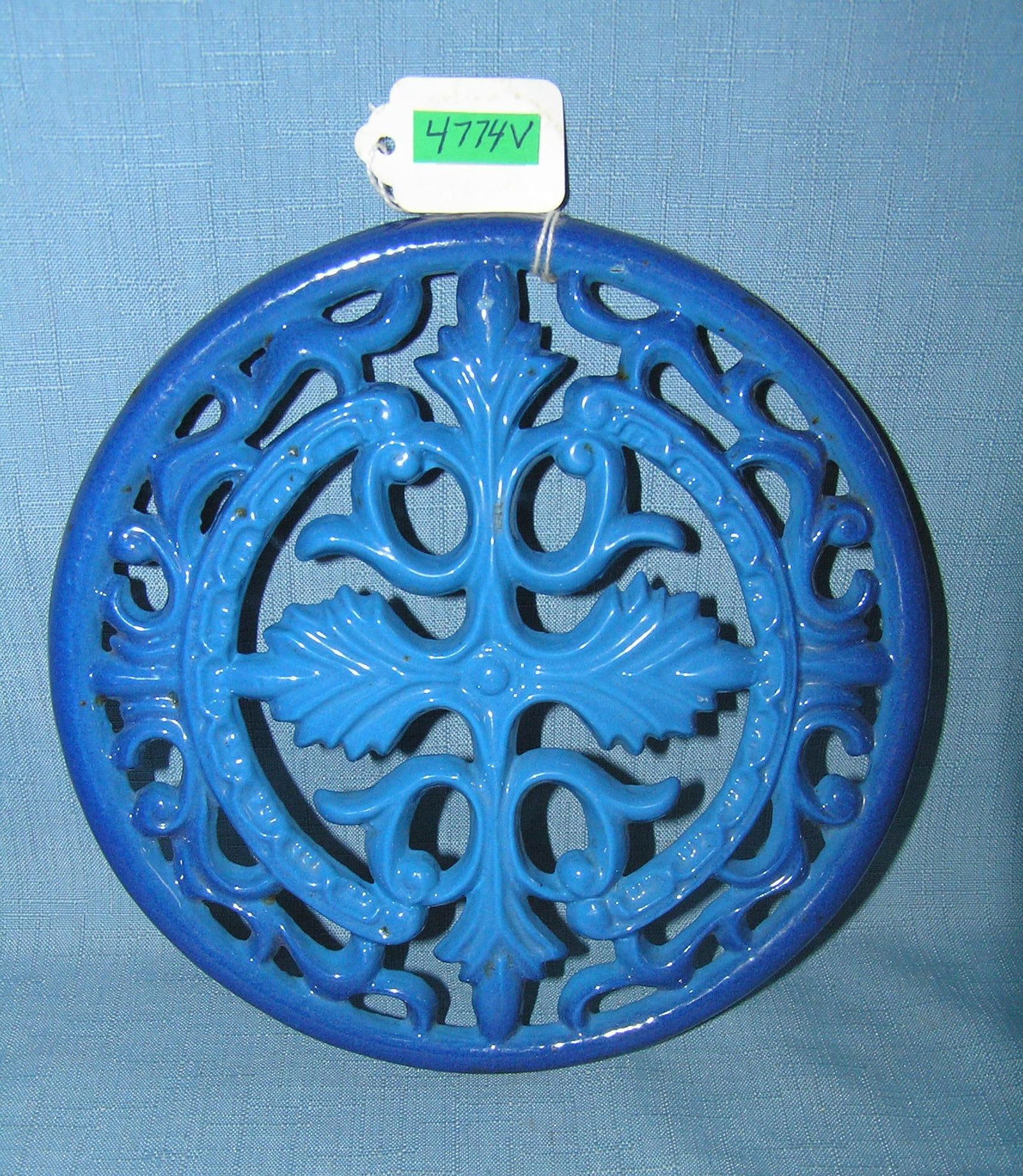Enamel over cast iron trivet 8 inches round: Enamel over cast iron trivet 8 inches round est. value $65.00-$75.00