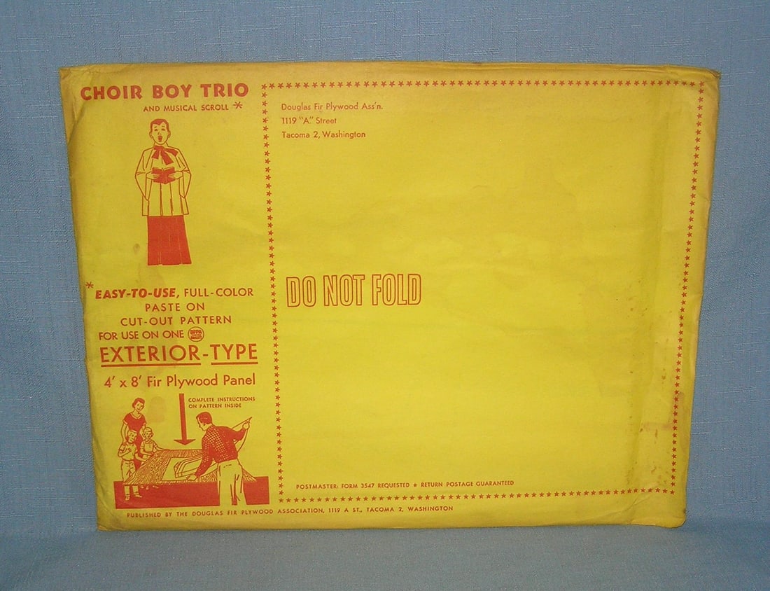 Choir Boy Trio and musical scroll Christmas paste-on decoration pattern: Choir Boy Trio and musical scroll Christmas paste-on decoration pattern still sealed in the original mailing envelope never opened ready to be pasted onto a 4 foot by 8 foot fir plywood panel made by