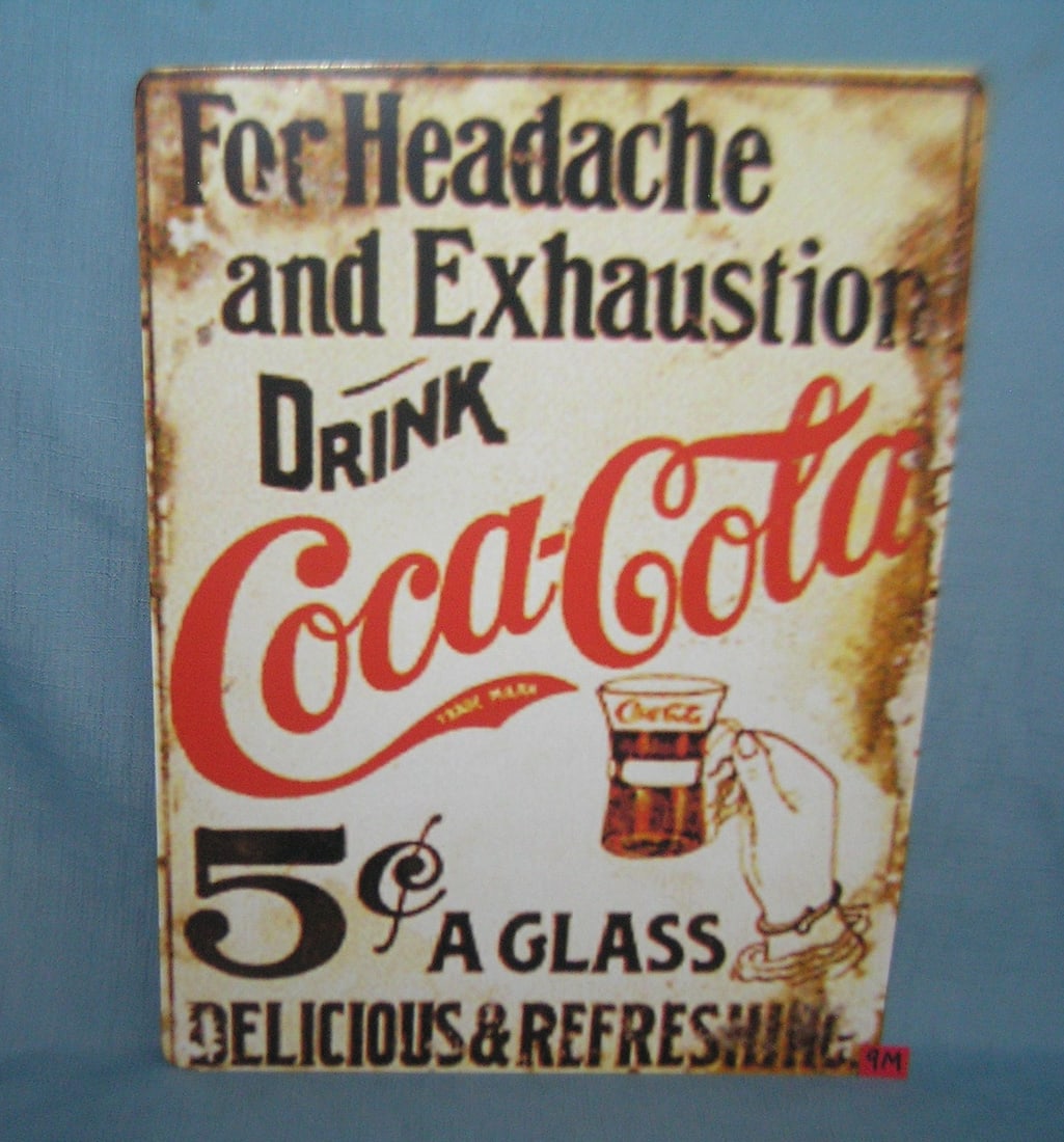 Drink Coca Cola 12 by 16 inches retro style sign: Drink Coca Cola for headache and exhaustion 12 by 16 inches retro style advertising sign printed on PVC hard board these signs are auctioned for there decorative and display purposes est. value $45.00