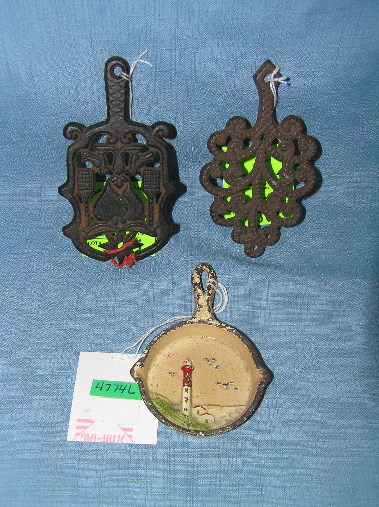Group of miniture cast iron trivets and frying pan: Group of miniture cast iron trivets and frying pan est. value $100.00-$125.00