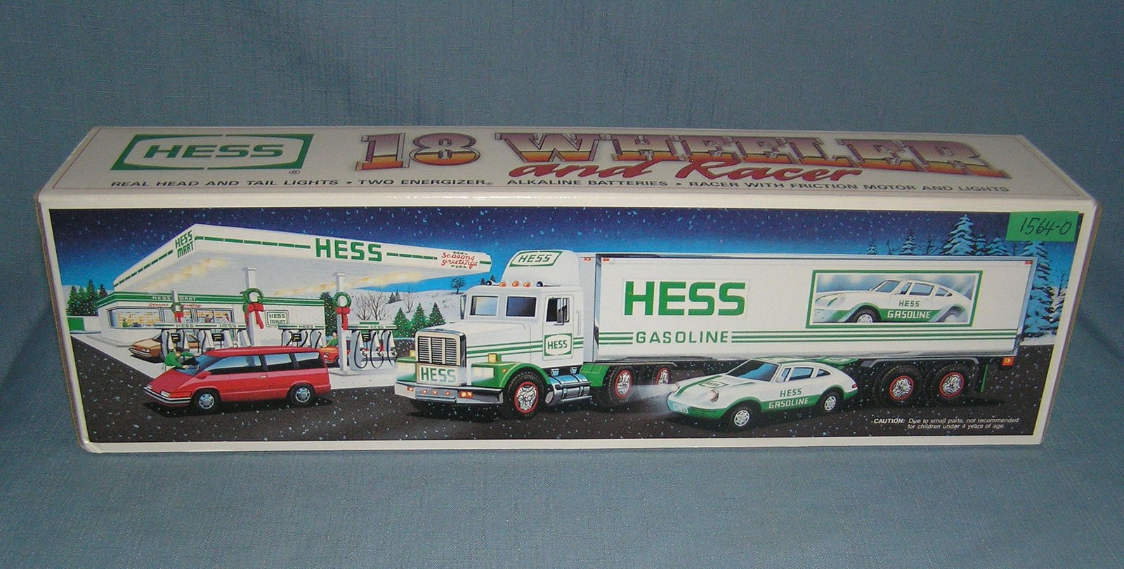 Hess 18 wheeler truck and race car with original box: Hess 18 wheeler truck and race car with original box est. value $65.00-$75.00